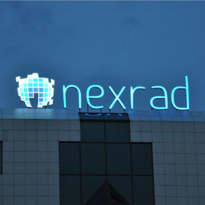 Illuminated logo on the rooftop